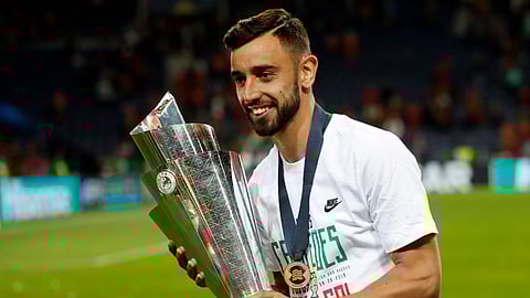 FILE - In this June 9, 2019, file photo, Portugal's Bruno Fernandes poses with the trophy at the end of the UEFA Nations League final soccer match between Portugal and Netherlands at the Dragao stadium in Porto, Portugal. According to news reports Wednesday, Jan. 29, 2020, Lisbon's Sporting CP midfielder Fernandes is expected to join Manchester United following months of negotiations between the two clubs. (AP Photo/Armando Franca, FILE)