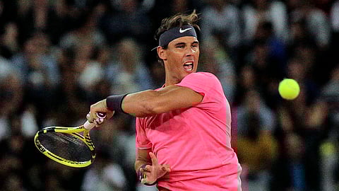Rafael Nadal in action during the exhibition tennis match against Roger Federer, held at the Cape Town Stadium in Cape Town, South Africa, Friday Feb. 7, 2020. (AP Photo/Halden Krog)