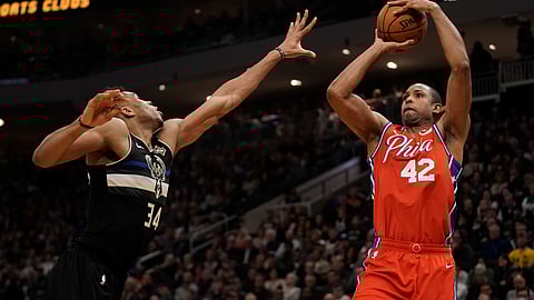 Philadelphia 76ers' Al Horford shoots past Milwaukee Bucks' Giannis Antetokounmpo during the first half of an NBA basketball game Thursday, Feb. 6, 2020, in Milwaukee.