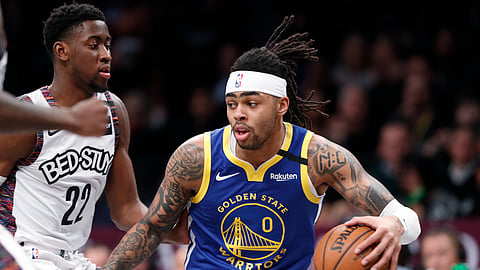 Golden State Warriors guard D'Angelo Russell (0) drives next to Brooklyn Nets guard Caris LeVert (22) during the first half of an NBA basketball game Wednesday, Feb. 5, 2020, in New York.