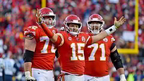 Kansas City Chiefs' Patrick Mahomes (15) celebrates a touchdown pass with Eric Fisher (72) and Mitchell Schwartz (71) during the second half of the NFL AFC Championship football game against the Tennessee Titans Sunday, Jan. 19, 2020, in Kansas City, MO. (AP Photo/Ed Zurga)
