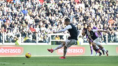 Juventus' Cristiano Ronaldo scores his side's second goal during the Serie A soccer match between Juventus and Fiorentina, at the Allianz Stadium in Turin, Italy, Sunday, Feb. 2, 2020. (Fabio Ferrari/Lapresse via AP)