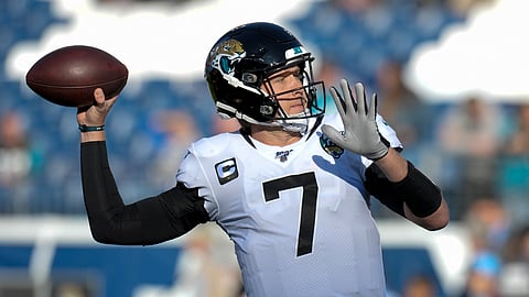 In this Nov. 24, 2019, file photo, Jacksonville Jaguars quarterback Nick Foles warms up before an NFL football game against the Tennessee Titans in Nashville, Tenn. The Jacksonville Jaguars have agreed to send quarterback Nick Foles to the Chicago Bears for a compensatory fourth-round draft pick.