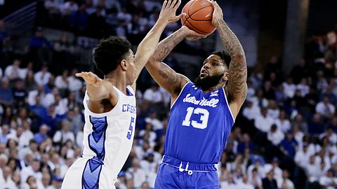 Seton Hall's Myles Powell (13) shoots against Creighton's Ty-Shon Alexander (5) during the first half of an NCAA college basketball game in Omaha, Neb., Saturday, March 7, 2020.