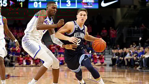 Villanova guard Collin Gillespie (2) gets past DePaul forward Paul Reed (4) during the first half of an NCAA college basketball game Wednesday, Feb. 19, 2020, in Chicago. (AP Photo/Jeff Haynes)