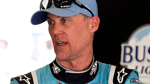 Kevin Harvick talks with crew members in his garage after a practice session for the NASCAR Daytona 500 auto race at Daytona International Speedway, Saturday, Feb. 15, 2020, in Daytona Beach, Florida.