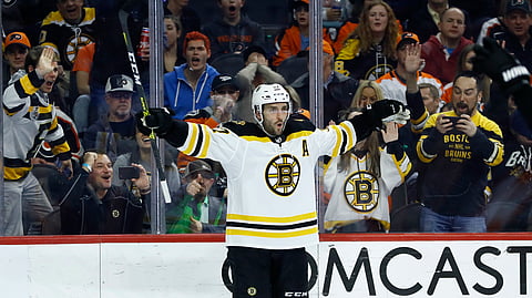 Boston Bruins' Patrice Bergeron celebrates after scoring a goal during the third period of an NHL hockey game against the Philadelphia Flyers, Tuesday, March 10, 2020, in Philadelphia. Boston won 2-0. (AP Photo/Matt Slocum)