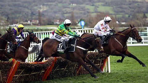 Barry Geraghty, jockey of Epatante, second right, goes on to win the Champion Hurdle on day one of the Cheltenham Festival at Cheltenham Racecourse, Cheltenham, England, Tuesday, March 10, 2020.