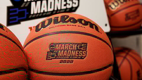 Official March Madness 2020 tournament basketballs are seen in a store room at the CHI Health Center Arena, in Omaha, Neb., Monday, March 16, 2020. Omaha was to host a first and second round in the NCAA college basketball Division I tournament, which was cancelled due to the coronavirus pandemic.