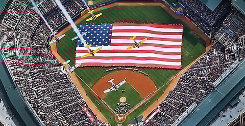 Vintage planes from the Cavanaugh Flight Museum flyover Globe Life Park during opening day ceremonies in Arlington, Texas, on March 31, 2014