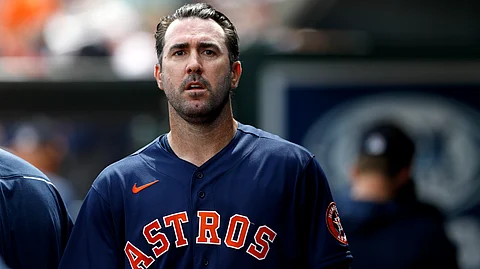 Houston Astros pitcher Justin Verlander walks in the dugout after pitching to the St. Louis Cardinals in the first inning of a spring training baseball game, Tuesday, March 3, 2020, in Jupiter, Fla. (AP Photo/Julio Cortez)