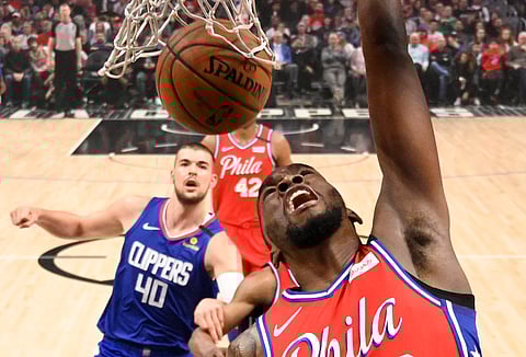 Sixers guard Shake Milton dunks as Clippers center Ivica Zubac watches March 1 (Mark J. Terrill)