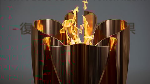 In this March 24, 2020, file photo, the Olympic Flame burns during a ceremony in Fukushima City, northern Japan. Tokyo Olympic organizers seem to be leaning away from starting the rescheduled games in the spring of 2021. More and more the signs point toward the summer of 2021. Organizing committee President Yoshiro Mori suggested there would be no major change from 2020.