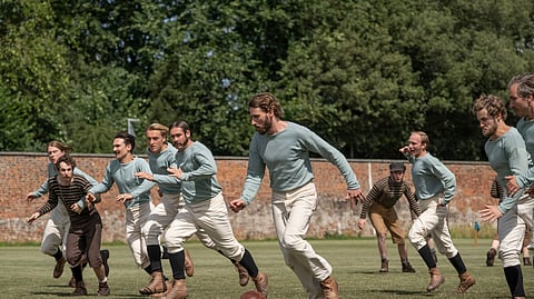 This image released by Netflix shows Edward Holcroft, foreground, in a scene from "The British Game," a six-part drama charting the origins of soccer.