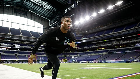 Ohio State defensive back Jeff Okudah stretches at the NFL football scouting combine in Indianapolis, Sunday, March 1, 2020.