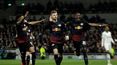 Leipzig's Timo Werner, center, celebrates after scoring his side's opening goal during a first leg, round of 16, Champions League soccer match between Tottenham Hotspur and Leipzig at the Tottenham Hotspur Stadium in London, England, Wednesday Feb. 19, 2020.