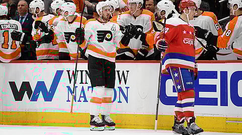 Flyers center Kevin Hayes celebrates his goal as Washington Capitals defenseman John Carlson skates nearby March 4 (Nick Wass)