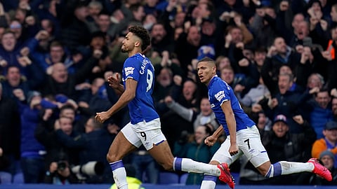 Everton's Dominic Calvert-Lewin runs celebrating after scoring a goal that was laster disallowed during the English Premier League soccer match between Everton and Manchester United at Goodison Park in Liverpool, England, Sunday, March 1, 2020.