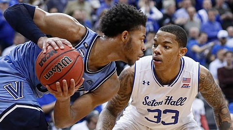 Seton Hall's Shavar Reynolds (33) faces off against Villanova's Justin Moore during the second half of an NCAA college basketball game Wednesday, March 4, 2020, in Newark, N.J. (AP Photo/John Minchillo)