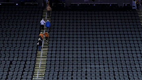 Fans leave the Sprint Center in Kansas City after the Big 12 Conference tournament was canceled March 12 (Charlie Riedel)