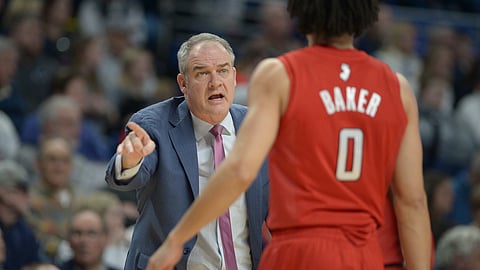 Rutgers coach Steve Pikiell gives some instructions to Geo Baker (0) during the first half of the team's NCAA college basketball game against Penn State, Wednesday, Feb. 26, 2020, in State College, Pa. (AP Photo/Gary M. Baranec)