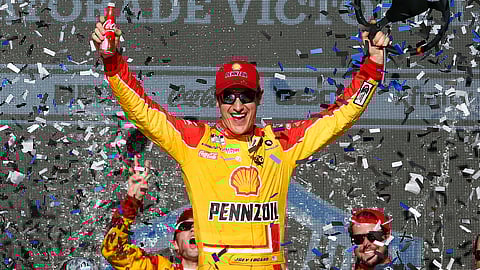 Joey Logano celebrates last year's victory at Phoenix Motor Speedway.
