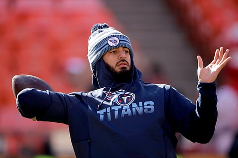 FILE - In this Jan. 19, 2020, file photo, Tennessee Titans' quarterback Marcus Mariota warms up before the NFL AFC Championship football game against the Kansas City Chiefs in Kansas City, Mo. The Las Vegas Raiders have agreed on a contract with free agent Mariota to provide an experienced backup behind starter Derek Carr. A person familiar with the deal said Monday, March 16, 2020, the Raiders reached the deal with the former No. 2 overall pick in the 2015 draft. (AP Photo/Charlie Riedel, File)
