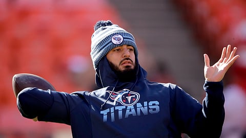 In this Jan. 19, 2020, file photo, Tennessee Titans' quarterback Marcus Mariota warms up before the NFL AFC Championship football game against the Kansas City Chiefs in Kansas City, Mo. The Las Vegas Raiders have agreed on a contract with free agent Mariota to provide an experienced backup behind starter Derek Carr. A person familiar with the deal said Monday, March 16, 2020, the Raiders reached the deal with the former No. 2 overall pick in the 2015 draft.