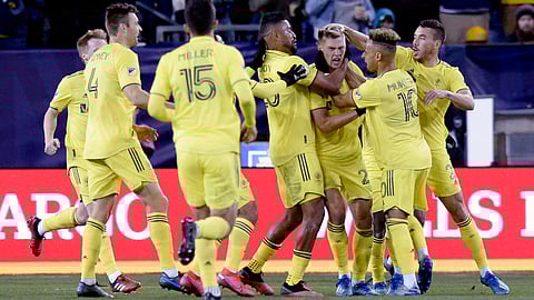 There was joy in Nashville when defender Walker Zimmerman (third from right) scored against Atlanta United on Feb. 29 (Mark Zaleski/The Tennessean via AP)