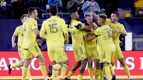 Nashville SC defender Walker Zimmerman, third from right, celebrates his goal against Atlanta United during the first half of an MLS soccer game in Nashville, Tenn., Saturday, Feb. 29, 2020.