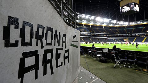 Eintracht fans have taped letters at a wall of the stadium during a Europa League round of 16, 1st leg soccer match between Eintracht Frankfurt and FC Basel in Frankfurt, Germany, Thursday, March 12, 2020. The match was played in an empty stadium because of the coronavirus outbreak.