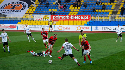In this file photo taken on Friday, March 27, 2020, players in action during the Belarus Championship soccer match between Torpedo-BelAZ Zhodino and Belshina Bobruisk.