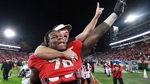 Isaiah Wilson carries Georgia head coach Kirby Smart after a win over Texas A&M on Nov. 23, 2019