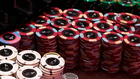 This Feb. 22, 2019 photo shows stacks of gambling chips at the Golden Nugget casino in Atlantic City N.J. As of Monday, March 16, 2020, casinos in at least 15 states had shut down due to the coronavirus, including Atlantic City's nine casinos which were due to close at 8 p.m.