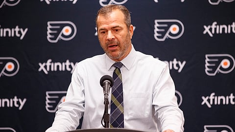 In this Sept. 21, 2019, file photo, Philadelphia Flyers head coach Alain Vigneault takes questions from the media following a preseason NHL hockey game against the New York Rangers in Philadelphia. No team was hotter at the time of the NHL break than the Philadelphia Flyers. Winners of nine of 10, they seemed poised to make a run in the Eastern Conference.