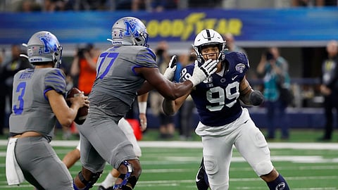 In this Dec. 28, 2019, photo, Penn State defensive end Yetur Gross-Matos (99) faces off against Memphis offensive lineman Obinna Eze (77) while quarterback Brady White (3) looks to pass during the second half of the NCAA Cotton Bowl college football game in Arlington, Texas.