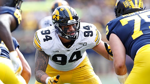 In this Oct. 5, 2019, file photo, Iowa defensive end A.J. Epenesa (94) plays against Michigan during the second half of an NCAA college football game in Ann Arbor, Mich. Patrick Queen of LSU and Epenesa are potential picks by the Baltimore Ravens if GM Eric DeCosta chooses to address the linebacker position early in the draft.