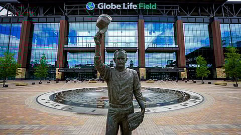 In this March 31, 2020, file photo, a statue of Nolan Ryan stands in the empty plaza outside Globe Life Field in Arlington, Texas. The new Texas Rangers ballpark is among possible venues Major League Baseball could use if it decides to start the season with groups of teams in different areas. Among the different plans looked at by Major League Baseball is to use Texas as a mid-American hub.