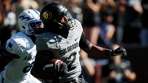 In this Sept. 14, 2019, file photo, Colorado wide receiver Laviska Shenault Jr., front, outruns Air Force defensive back Zane Lewis to the end zone for a touchdown in the first half of an NCAA college football game in Boulder, Colo. Shenault Jr. looked like a first-round pick after his breakout season in 2018. His health, coupled with his production falling off last year, might keep him on the board longer than he expected. (AP Photo/David Zalubowski, File)