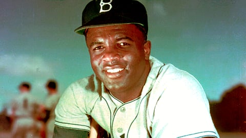 In this 1952 file photo, Brooklyn Dodgers baseball player Jackie Robinson poses. Forced from the field by the new coronavirus, Major League Baseball is moving its annual celebration of Jackie Robinson online. The Jackie Robinson Foundation is launching a virtual learning hub to coincide with the 73rd anniversary Wednesday, April 15, 2020, of Robinson breaking the major league color barrier.