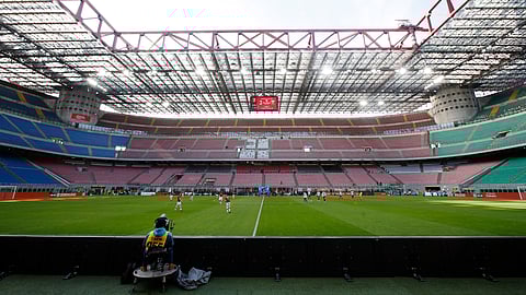 In this Sunday, March 8, 2020 filer, a view of the empty stadium during the Serie A soccer match between AC Milan and Genoa at the San Siro stadium, in Milan, Italy. While soccer leagues around Europe are still debating whether and when to resume playing, the leader of the continent’s Federation of Sports Medicine Associations is calling for a detailed series of tests to clear athletes for a return to training.