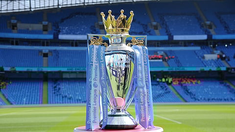 In this Sunday, May 6, 2018 file photo, the English Premier League trophy is displayed on the pitch prior to the English Premier League soccer match between Manchester City and Huddersfield Town at Etihad stadium in Manchester, England. Steve Parish, the chairman of Crystal Palace, says the Premier League could face years of legal challenges if this season is not completed due to the coronavirus pandemic.
