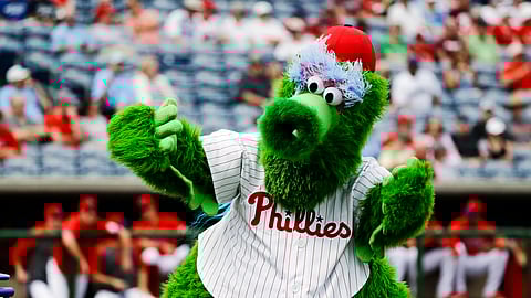 In this Feb. 25, 2020, file photo, The Phillie Phanatic mascot performs before a spring training baseball game against the Toronto Blue Jays in Clearwater, Fla. Mascots have no other place in baseball should the sport resume. Mascots will be banned.