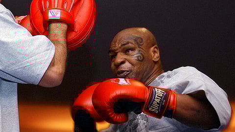 In this Aug. 30, 2006, file photo, former heavyweight boxing champion Mike Tyson spars during a training exhibition in Las Vegas. Tyson hasn’t announced any plans to return to the ring, though he did suggest on an Instagram post he might make himself available for 3 or 4-round exhibitions if the price was right.