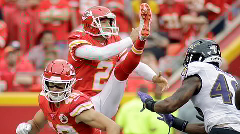 Dustin Colquitt punts against the Ravens last September