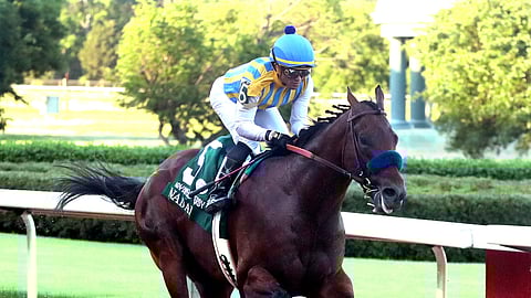 Joel Rosario, top, and Nadal cross the wire to win the second division of the Arkansas Derby horse race Saturday, May 2, 2020, at Oaklawn Racing Casino Resort in Hot Springs, Ark.
