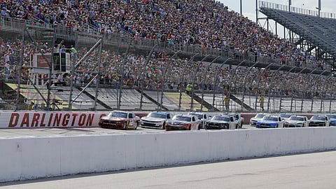 FILE - In this Aug. 31, 2019, file photo, Ryan Blaney leads the field to the start the NASCAR Xfinity Series auto race at Darlington Raceway in Darlington, S.C. NASCAR will resume its season without fans May 17 at Darlington. (AP Photo/Terry Renna, File)