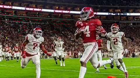 In this Oct. 26, 2019, file photo, Alabama wide receiver Jerry Jeudy (4) scores on a pass reception against Arkansas during the first half of an NCAA college football game in Tuscaloosa, Ala.