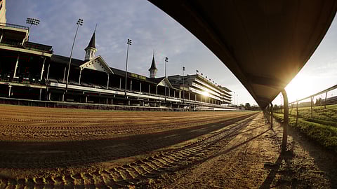 The sun rises over the track at Churchill Downs, Thursday, May 7, 2020, in Louisville, Ky.