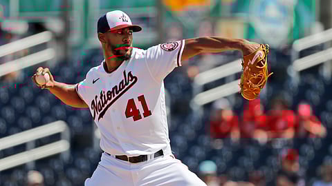 In a Monday, March 2, 2020 file photo, Washington Nationals pitcher Joe Ross throws during the first inning of a spring training baseball game against the Miami Marlins, in West Palm Beach, Fla. Longtime infielder Ryan Zimmerman and pitcher Joe Ross are opting out of playing the 2020 season as Major League Baseball tries to get back amid the COVID-19 pandemic.